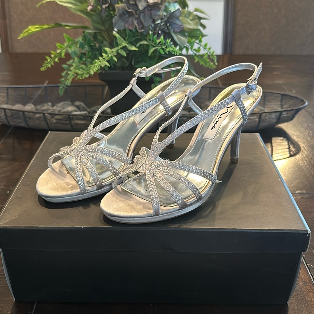 Silver women’s heels barely worn size 6.5